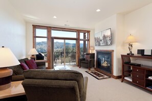 Main Living Space - Gas Fireplace, TV and deck with awesome views