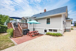 Patio with grill and outdoor dining area