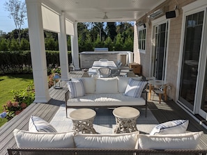 Rear porch including Infratech heaters, Sonos speakers, solar shades and fans