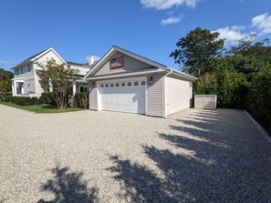 Rear parking area for three cars (two indoor, one outdoor)