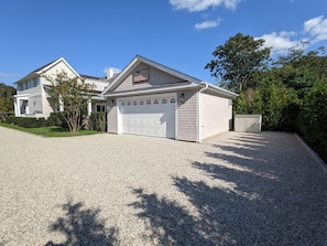 Rear parking area for three cars (two indoor, one outdoor)