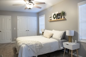 master bedroom with king bed, soft linens, and extra blankets