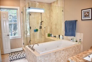 Master jetted tub and dual headed walk in shower. 