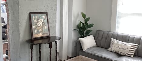Living Room w/Sofa Sleeper & Ottoman w/ linens & essentials