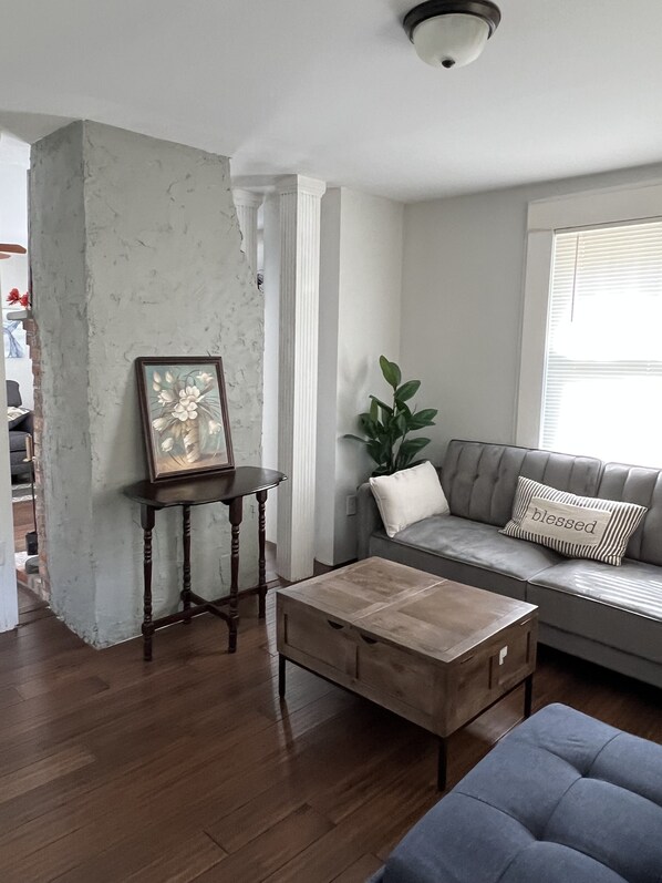 Living Room w/Sofa Sleeper & Ottoman w/ linens & essentials