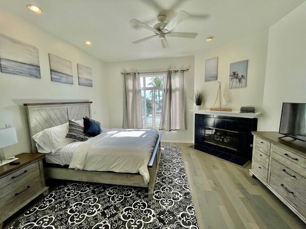 Master bedroom with queen size bed and smart TV