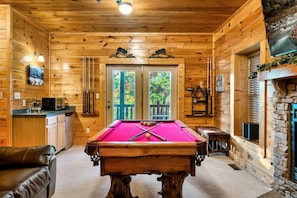 Game room with pool table and video arcade