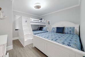 Sleep 4 in the guest bedroom with a queen bed and bunk bed