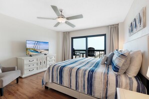 The Master Bedroom includes a King bed, TV, and private access to the balcony overlooking Ormond Beach