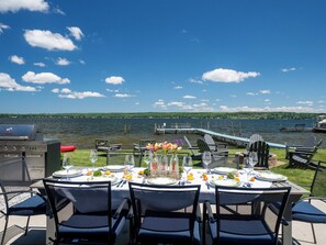 Lakefront dining table with seating for 8 around the table