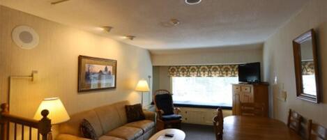 Living Room with Dining Table and TV with DVD player in Condo at Waterville Valley