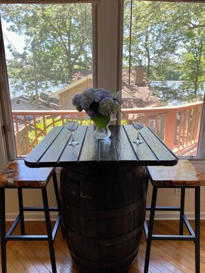 Enjoy a meal on our vintage rum barrel table while admiring the lake.