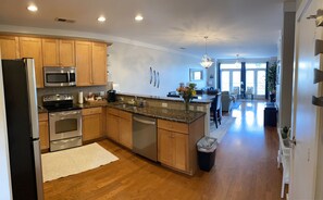 Open floor plan including kitchen, dining, and living room to entertain guests. 