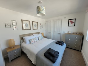 Top floor ensuite king bedroom with sea view window