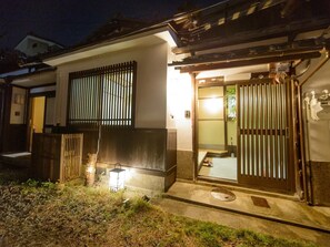 A gentle light illuminates the building at night