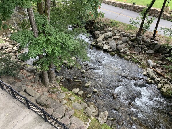 View from your balcony complete with rocking chairs and patio table/chairs