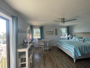 View from kitchen. Small balcony overlooking beach to the left.