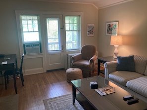 Living room seating leading out to a porch