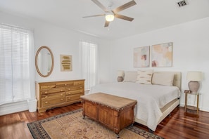 Downstairs master bedroom has a king bed with new paint, furniture, and tasteful decor + private bathroom and patio.