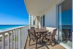 Spacious patio with plenty of seating, perfect for soaking in those Emerald Coast Views - accessible from the living room AND Master bedroom