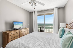 Spacious master bedroom is beautifully decorated and features a King bed, Gulf views, balcony access, TV w/ cable access, private bathroom, and large closet.