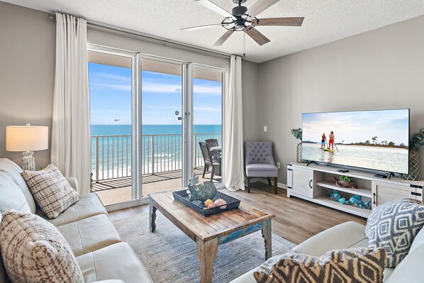 Spacious living area with plenty of seating on New Leather Furniture, Queen sleeper sofa, 65" Smart TV, relax while enjoying those incredible GULF VIEWS!