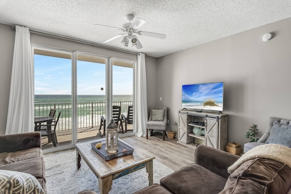 Spacious living area with plenty of seating, Queen sleeper sofa, Gulf views, 65" Smart TV with easy access to Roku, Prime TV, Netflix, etc. - New flooring was installed in December 2021