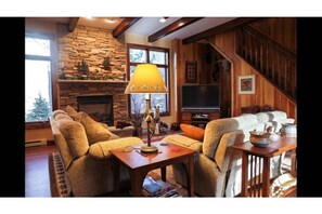 Gas fireplace in 2nd family room. Very comfy couches & nice view of rock garden