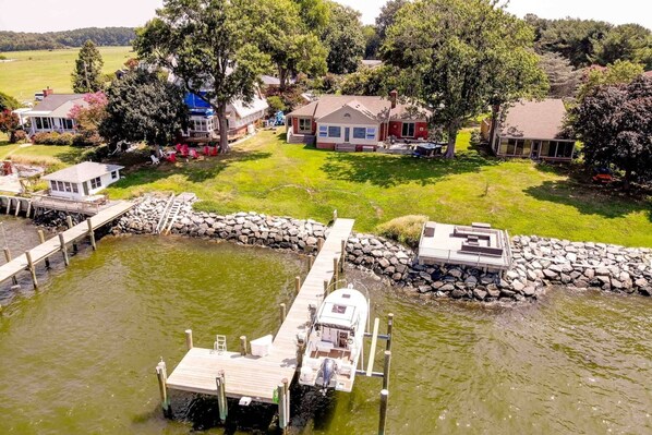 Welcome to the waterfront Seize the Bay with a private pier (boat pictured not included in rental).