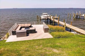 Soak up the sunshine on the private furnished waterfront deck.