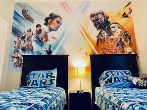 Kids will enjoy this futuristic galaxy's edge room complete with themed designs!