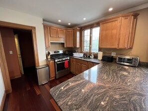 Fully stocked Kitchen, granite countertops