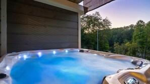 Soak with a view. Unwind in the private hot tub after a day of exploring the Smokies.