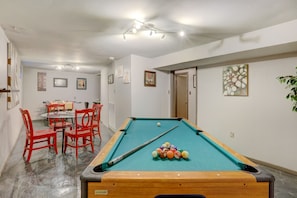 Game room with pool table, dart board & table for games