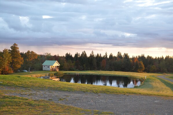 The cabin bathed in the pink light and stillness of the morning