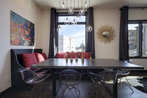 Dinner table to enjoy with friends and neighborhood view form the window.