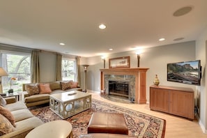 Grand living room with Large wood burning fireplace 