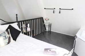 Balcony bedroom. A queen bed and spa bath. 