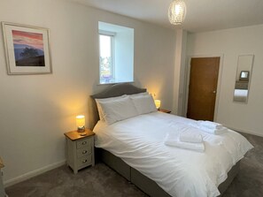 Bedroom 1 has a king size bed, TV, drawers, wardrobe and blackout blinds.
