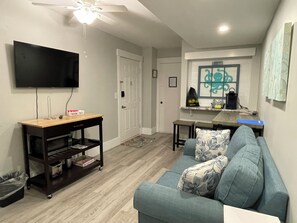 Living room with Smart TV and coffee bar