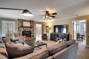 Living room with large sectional couch and gas fireplace.