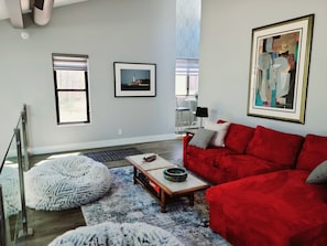 Loft with stunning glass wall overlooks great room