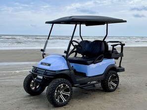 Golf cart- separate rental/waiver 4 seater, extended roof, ice chest & sound bar