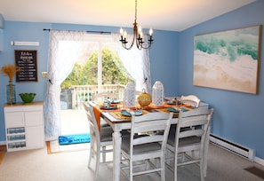Dining room sits six, patio doors leads out to a lounge area & additional seatin