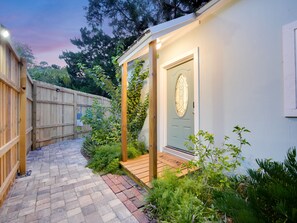 Private garden runs along all sides of the tiny home.