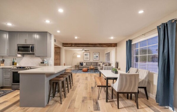 Large open concept kitchen, dining and living rooms.  