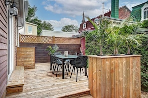 Terrace with dining table and barbecue