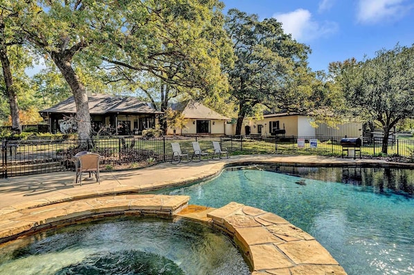 Pool, spa and fire pit. Backyard is canopied by huge oak trees.