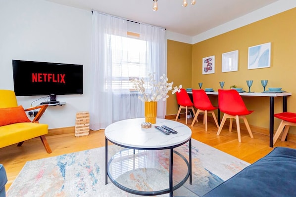 Living Room: Bright and stylish retreat with a Netflix binge-worthy vibe and vibrant décor!