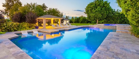 Amazing pool & cabana lighting w/ soccer field & gym behind